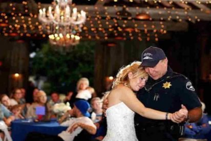 officers dance bride wedding 412x275.jpg?resize=412,275 - During Their Dance, A Bride Cries On The Officer's Chest And Then She Turns Around And They See What's On Her Back...