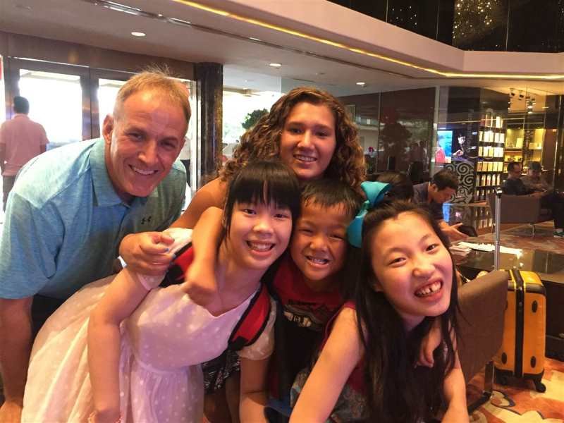 Gene Lumpkins (top left), Madison Lumpkins, biological daughter of Gene & Lisa (center rear), Avery (front left), Noah (center) and Molly (right). Image via Eric Bacuilnao / NBC News.