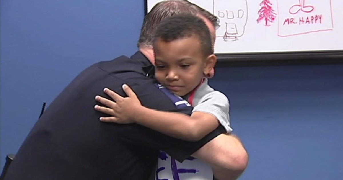 boy sign walks police cover 1.jpg?resize=412,275 - 5-Year-Old Boy Walked In Police Station Offering Free Hugs To Officers Amid Tensions Within The Community