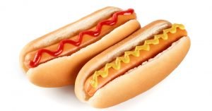 Hot dogs with ketchup and mustard isolated on white background.