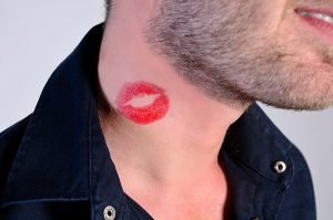 closeup of man with lipstick on neck