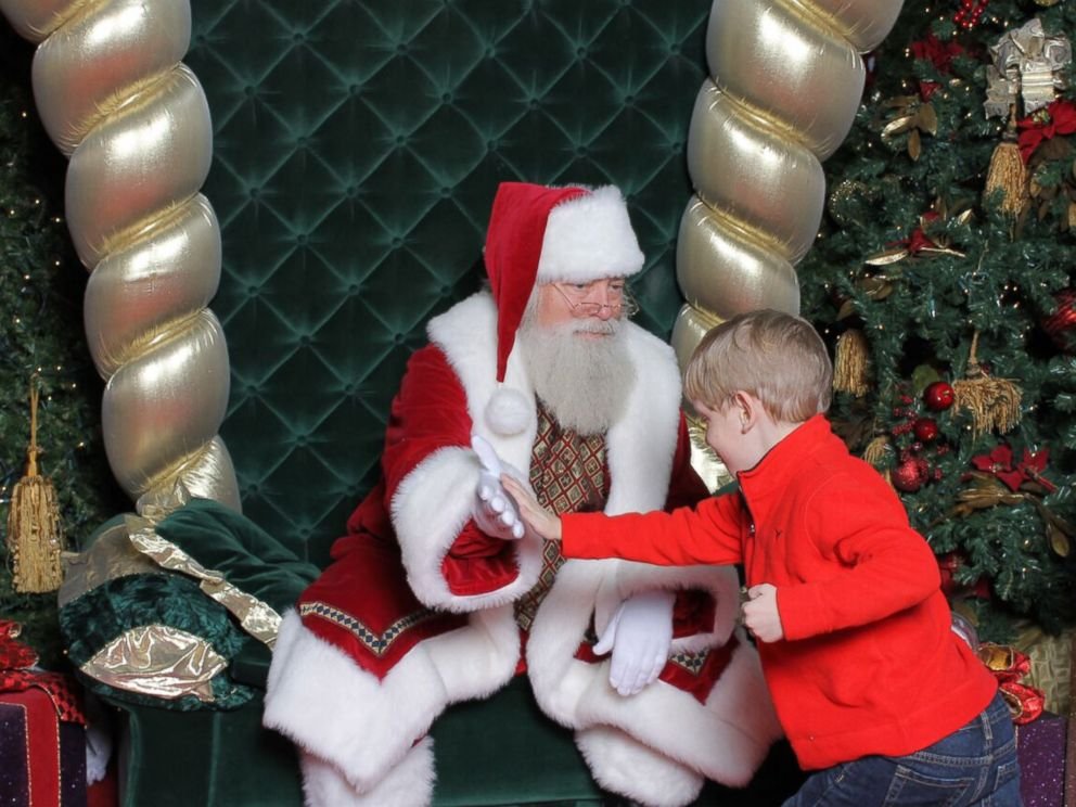 PHOTO: His mom said it took about 20 minutes, but Brayden finally warmed up to Santa. 