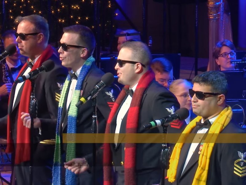 Navy Band Performs White Christmas, Man In Yellow Scarf Surprises The