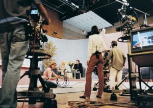 TV Presenters in a TV Studio With Producers and TV Cameramen