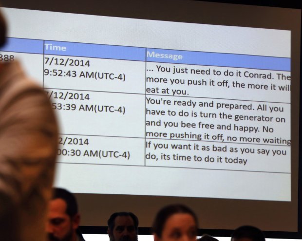 Michelle Carter's text messages are displayed as prosecutor Maryclare Flynn delivers her opening statement in Carter's trial, Tuesday, June 6, 2017, in Taunton, Mass. Carter is charged with manslaughter for allegedly using text messages to encourage her boyfriend, Conrad Roy III, 18, to kill himself. (Pat Greenhouse/The Boston Globe via AP, Pool)