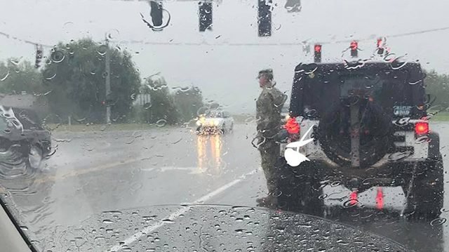 soldier.jpg?resize=300,169 - Solider Salutes Stranger's Funeral Procession Under Heavy Rain