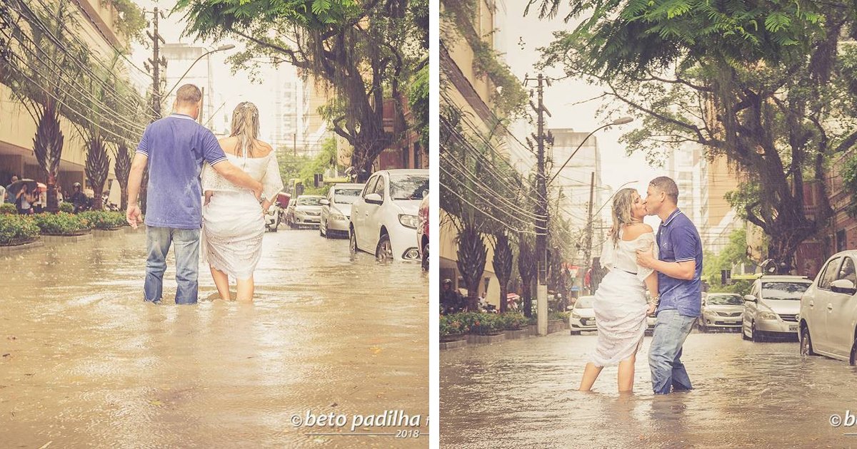 thumbnail5giu9.png?resize=1200,630 - Amor até debaixo d'água: Noivos fazem ensaio fotográfico de casamento em uma rua alagada