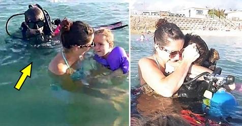 safe image 1 1.jpg?resize=412,232 - Mother Playing With Her Kids In Water Got Surprised By Her Soldier Husband In Scuba Diving Suit