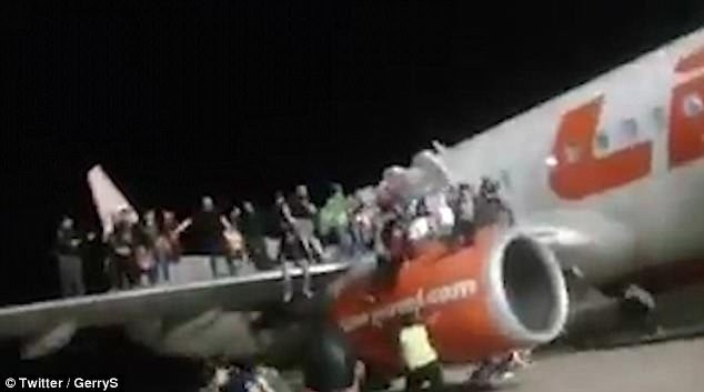 Hoax:Â Footage shows dozens standing on the right wing as panic broke out on the Lion Air Boeing 737, which was due to carry 189 passengers to Jakarta on Monday night