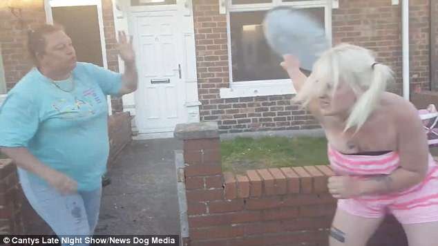 The pair walk out menacingly onto the street to continue their outrageous brawl. Lyndsey grabs the lid off a council bin and flings it at Black Juicy