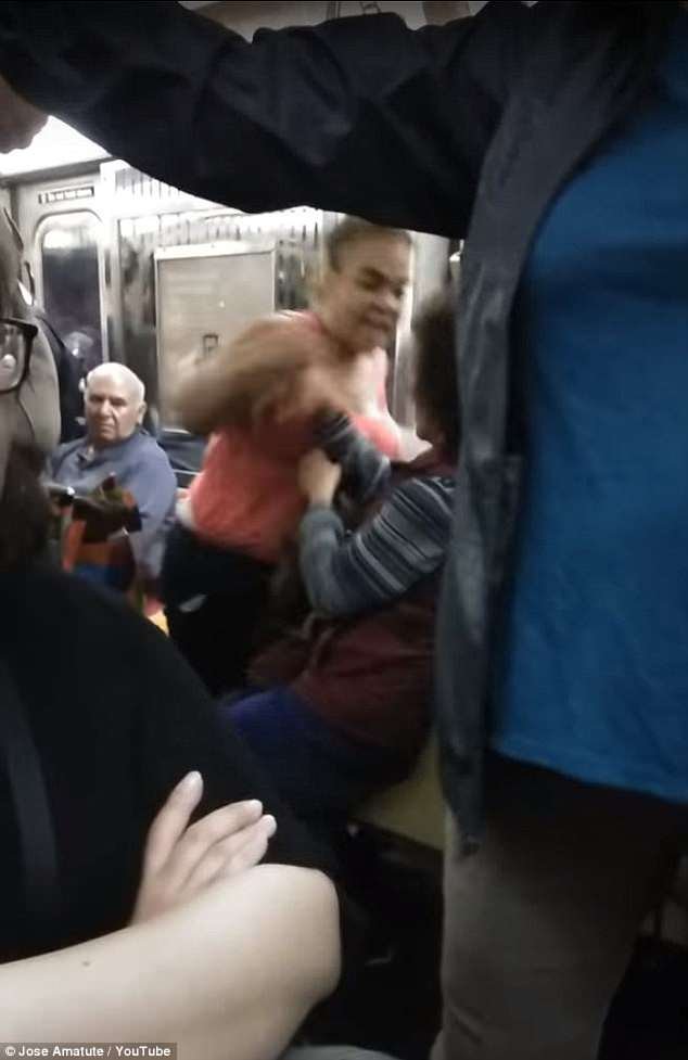 In a video uploaded on May 30 a bystander filmed the moment the angry mother forcibly pushed the Asian woman out of her seat
