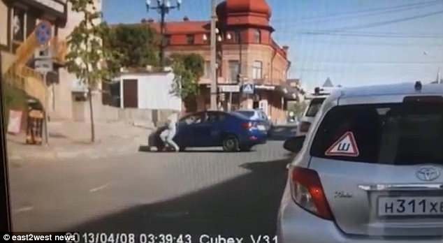 The video shows the 26-year-old woman storming away when, appallingly, the driver performs an aggressive U-turn and smashes straight into her