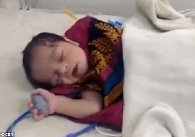 The baby was found after local residents heard her crying and she has been taken to a local hospital, where it is said she remains in a critical condition