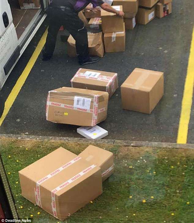 Packages thrown from the van lie strewn on the tarmac. At least four of them have 