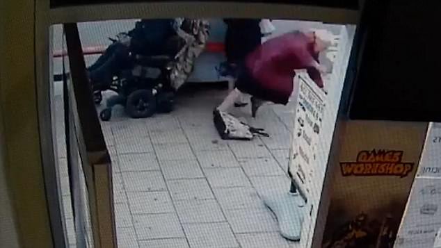 The callous scene is caught on CCTV from inside a convenience store and shows the scooter driver move past the shop before reversing into the two women, both believed to be in their nineties