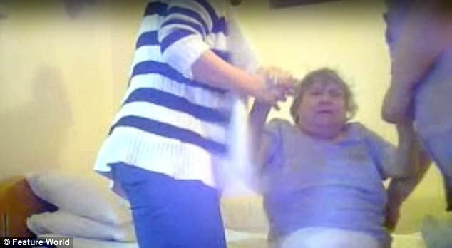 Sickening footage at Brookside House Care Home in Nottinghamshire shows Joy Lewis, 71, being dragged out of bed by her wrists in the early hours of the morning