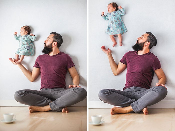 Dad Playing With Newborn Daughter