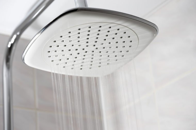 Closeup on showerhead while running water