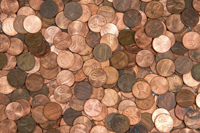 Flat view pennies. United States currency penny, many old new dirty clean viewed from directly above. The penny is the lowest denomination coin in the U.S. currency.