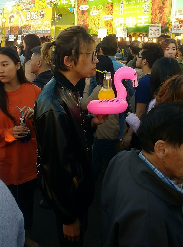 Drink Served In A Lightbulb On A Flamingo Inner Tube