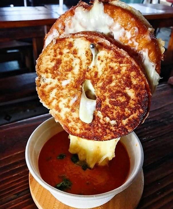  Grilled Cheese Suspended On Metal Hook Above Bowl Of Soup