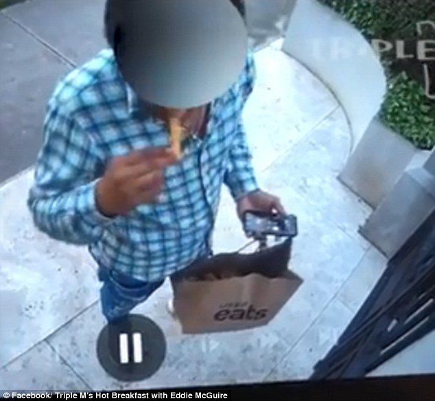 Home security footage has exposed a food delivery driver helping himself to a meal while he waited for an unsuspecting customer to come to the door