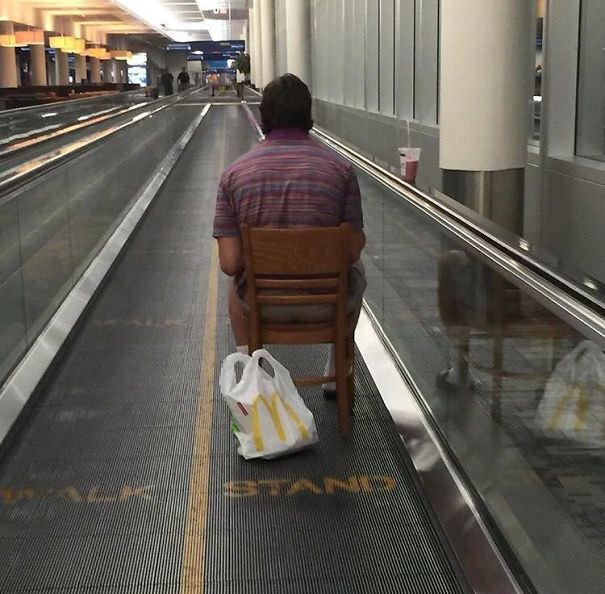 My Buddy Spotted This Guy At The Airport On The Moving Walkway, Sitting In A Chair, Eating McDonalds While Catching Pokemon