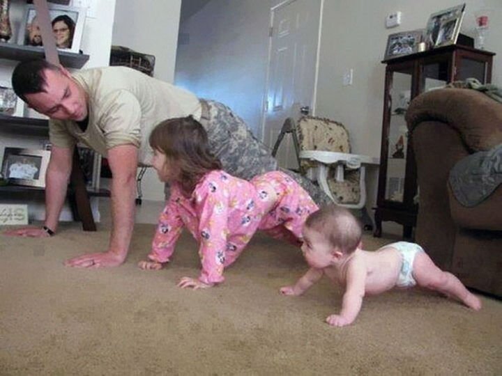 16 Super Dads Are Heroes to Their Kids - This father showing his kids how to stay fit. The baby doing pushups is priceless.