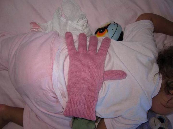 21 Best Mom Hacks - Place a barley or bean filled glove on your baby