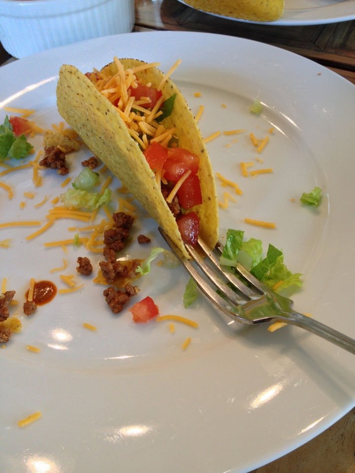 21 Everyday Life Hacks - Use a fork to prevent your taco from falling over when loading it.