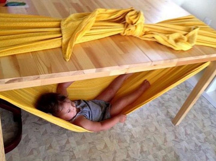 24 Life Hacks for Kids - Make a quick hammock using only a table and a blanket.