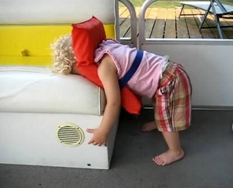 25 Kids Sleeping in the Strangest Places - So much for a scenic boat ride.
