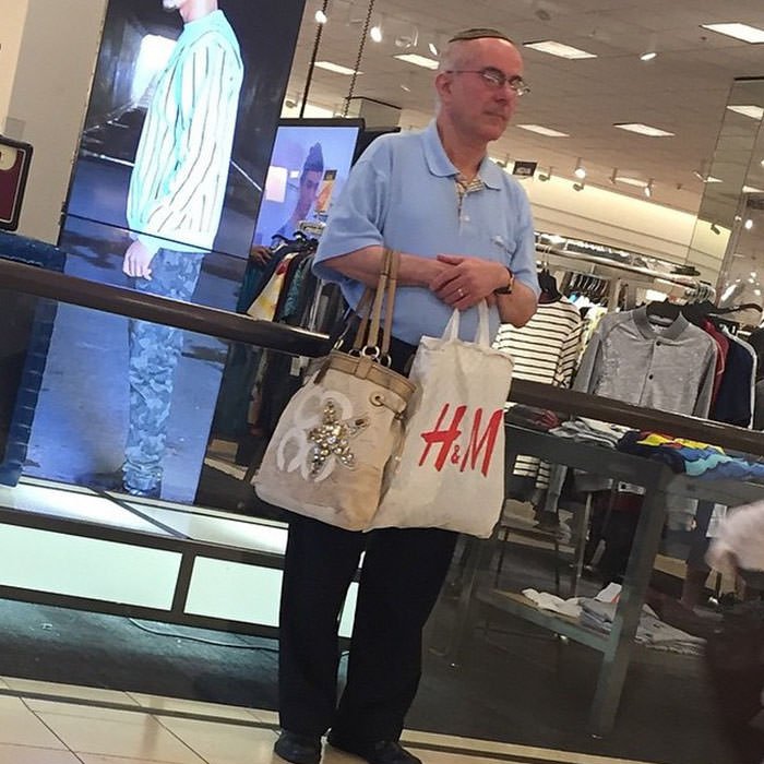 Miserable men shopping 