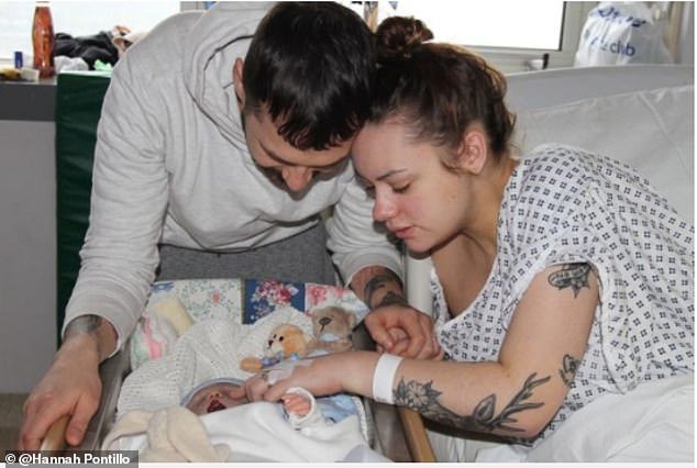 Supermarket worker Hannah and her husband retail manager Phil, 30, with baby Dexy in the hospital