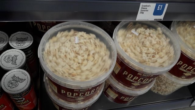 The tops of these popcorn tubs make it look like the popcorn is spinning around very fast.