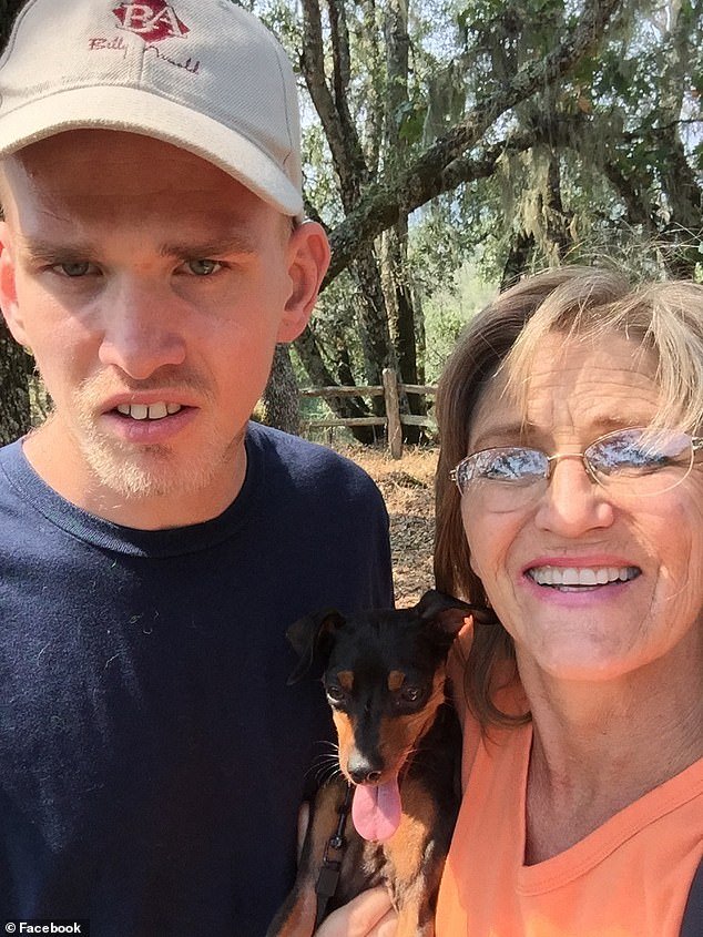 Lance Grumley and his mom, Dina, are all smiles as they pose for a photo with a dog during a previous outing