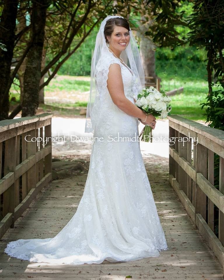 Image may contain: 1 person, smiling, standing, wedding and outdoor