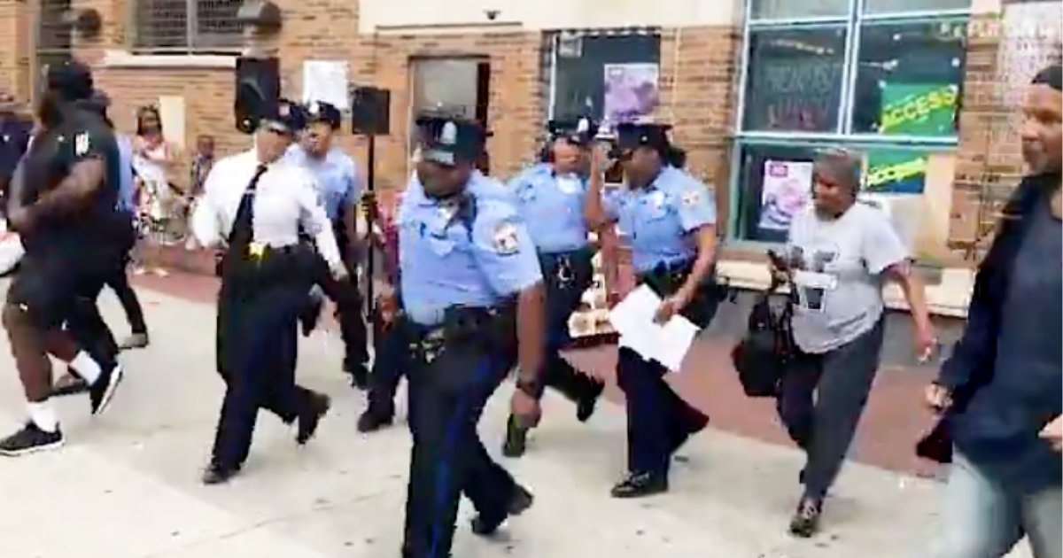 d2 17.png?resize=412,275 - The Police Officers are Seen Dancing to The Electric Slide
