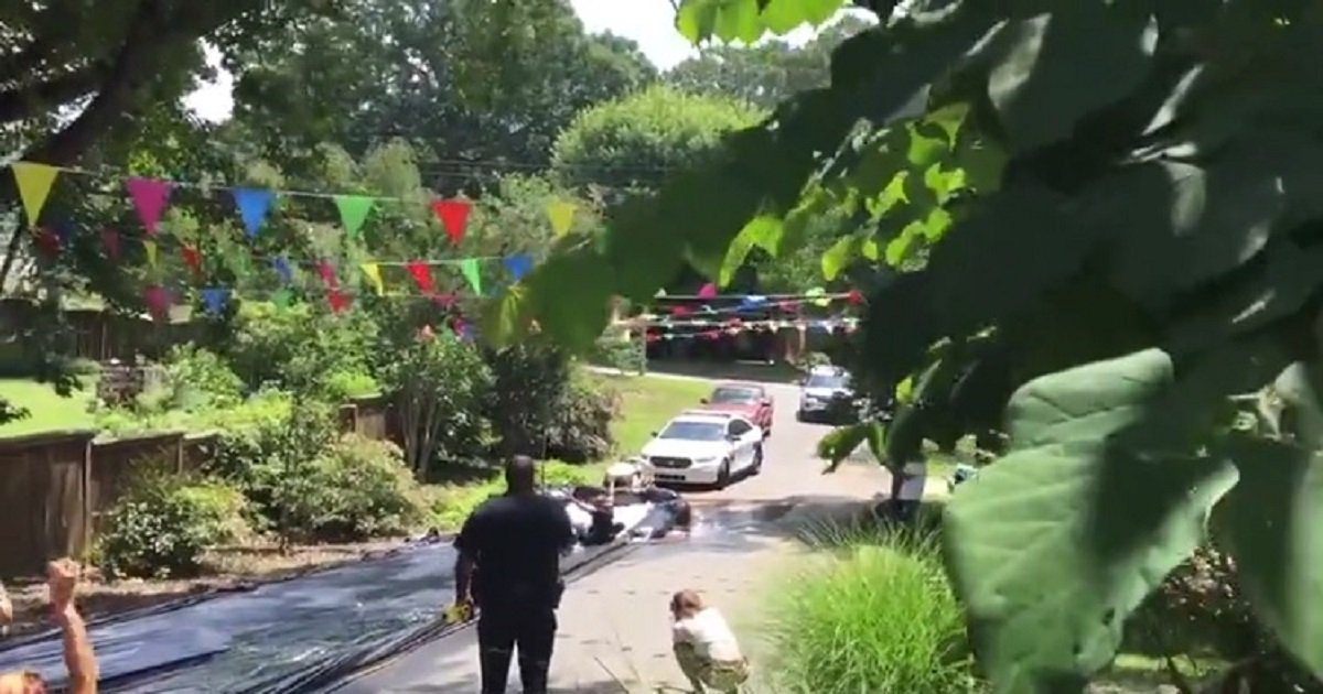 p3 3.jpg?resize=412,275 - Police Were Called To Shut Down A Neighborhood Slip'N Slide - They Joined The Fun Instead