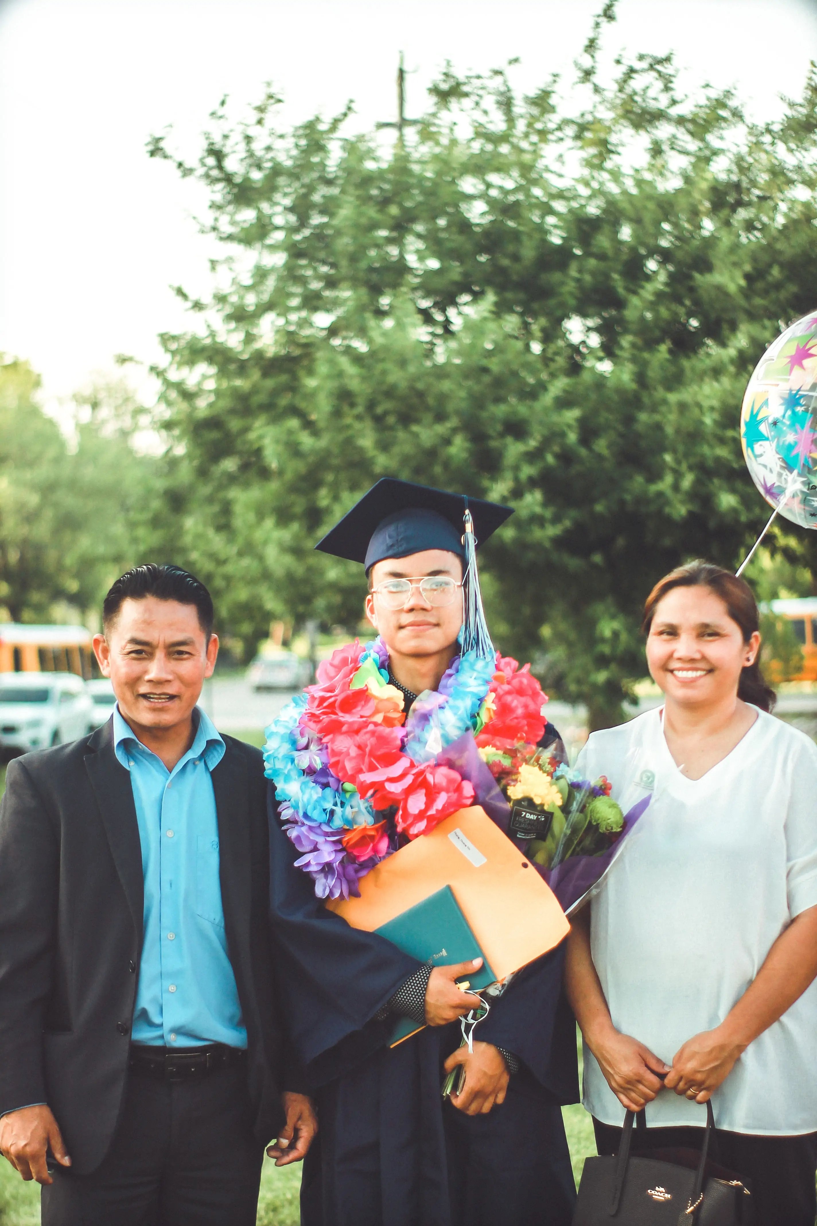 https://www.pexels.com/photo/photo-of-a-man-wearing-academic-gown-together-with-his-parents-2513989/
