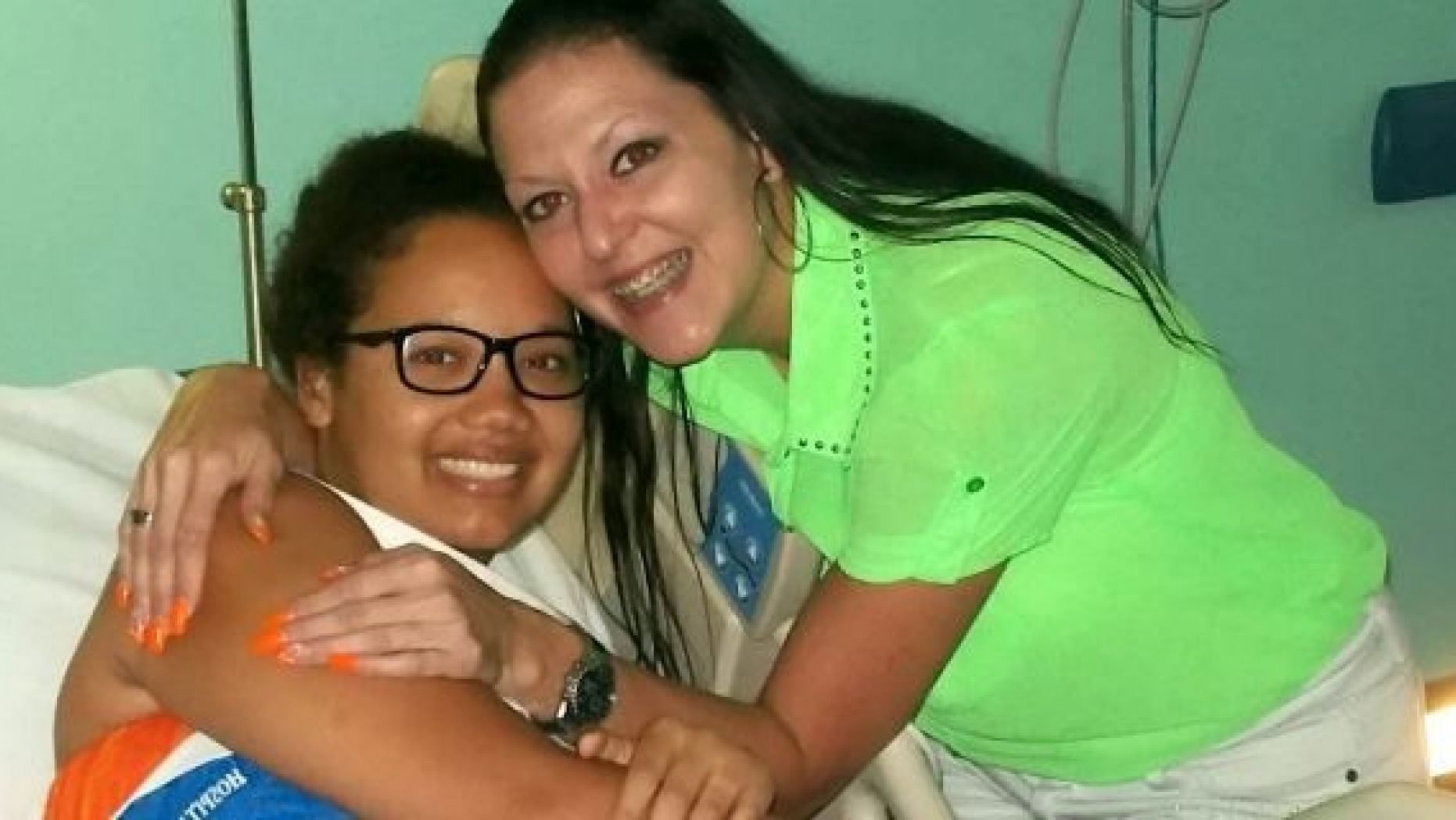Gabrielle Newell, pictured with her aunt while in the hospital, said reconnecting with her faith in 2016 helped her find closure and forgiveness.
