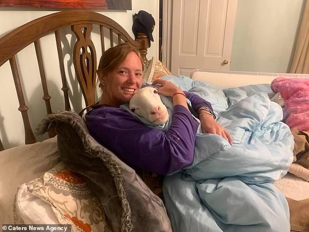 Kristin, from North Carolina, pictured with Moko, said they let him sleep in their bed and will do anything to help make 