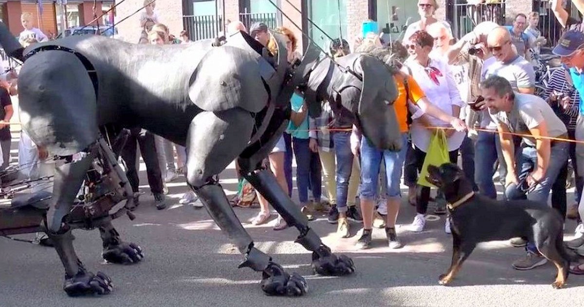 dog met puppet dog.jpg?resize=412,275 - Rottweiler And A Giant Puppet Dog Become Friends At A Parade