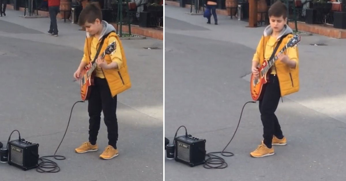 kid street performer.jpg?resize=412,275 - La star du jour: Un jeune artiste joue du Metallica en pleine rue !