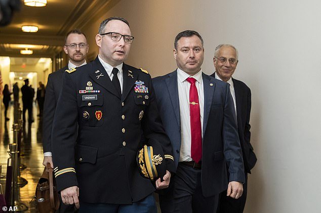 National Security Council aide Lt. Col. Alexander Vindman, left, and his twin brother, Yevgeny Vindman, right, in November of last year