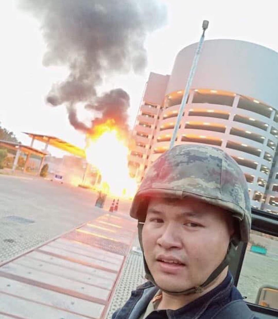 A picture shows Jakrapanth Thomma, who is the alleged attacker, in front of an explosion at the mall today