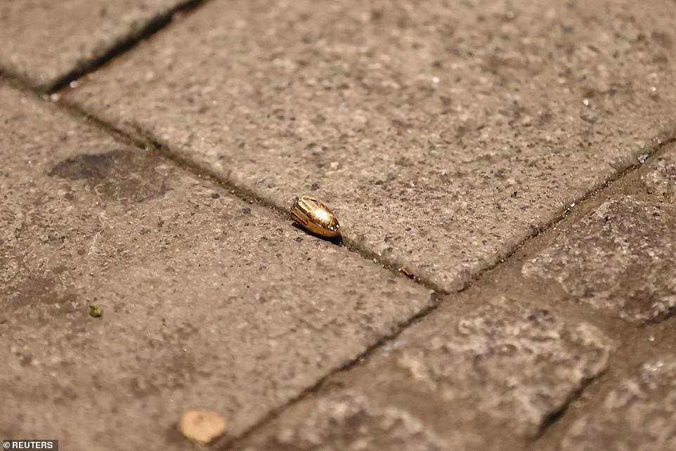 A bullet seen on the ground after a drive-by shooting in Hanau near Frankfurt last night. Six people were in a critical condition