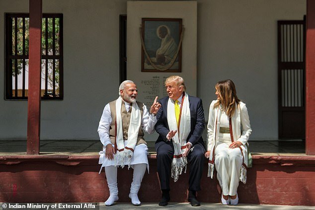 President Donald Trump and First Lady Melania Trump listen to India