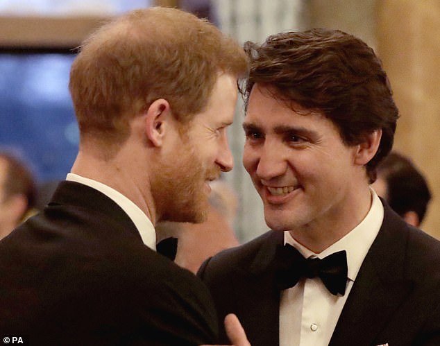 Prince Harry greets Justin Trudeau in the Blue Drawing Room at Buckingham Palace in London during the Commonwealth Heads of Government Meeting in April 2018. Mr Trudeau had previously promised that the couple would be safe when in Canada