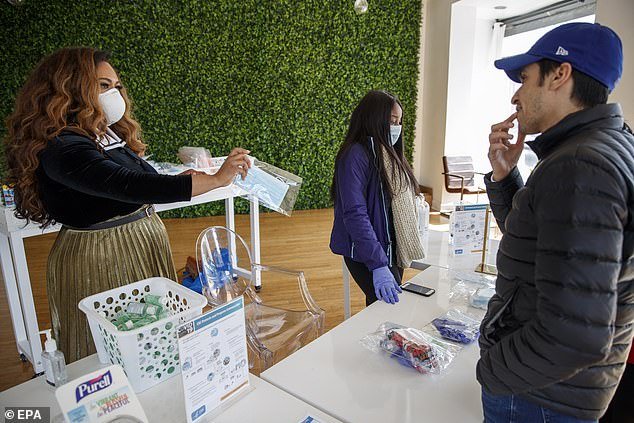The spread of the deadly disease could be far worse than officials claim, with 480,000 Americans expected to die from the virus and 4.8 million hospitalized, according to estimates from University of Nebraska professor Dr. James Lawler. People are pictured buying hand sanitizer in Washington DC Friday